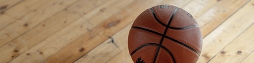 Basket ball on court in March Madness