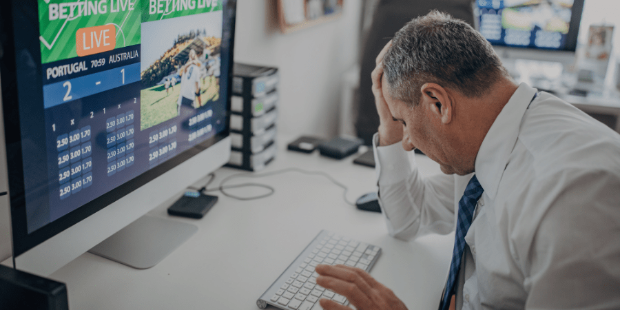 man stressed while sports betting