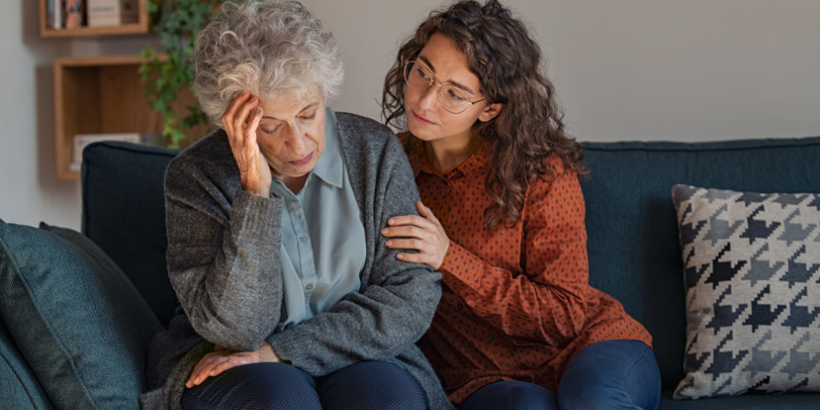 girl comforting grandmother