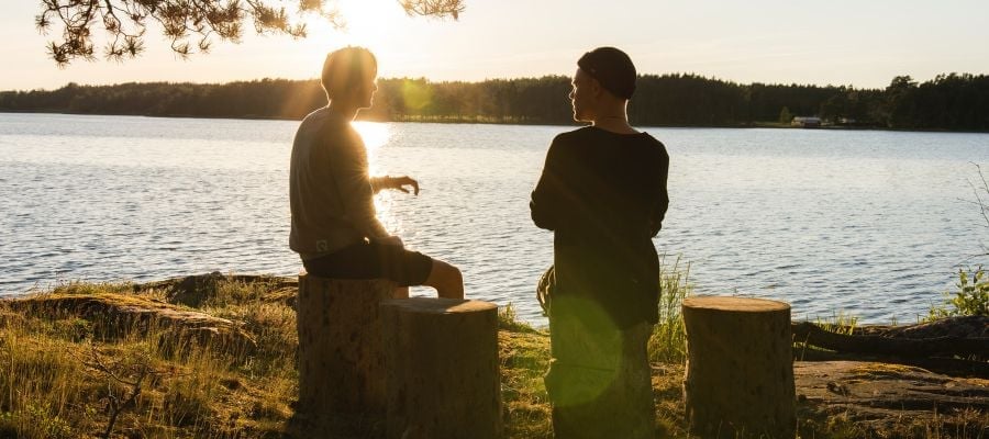 man confiding in friend