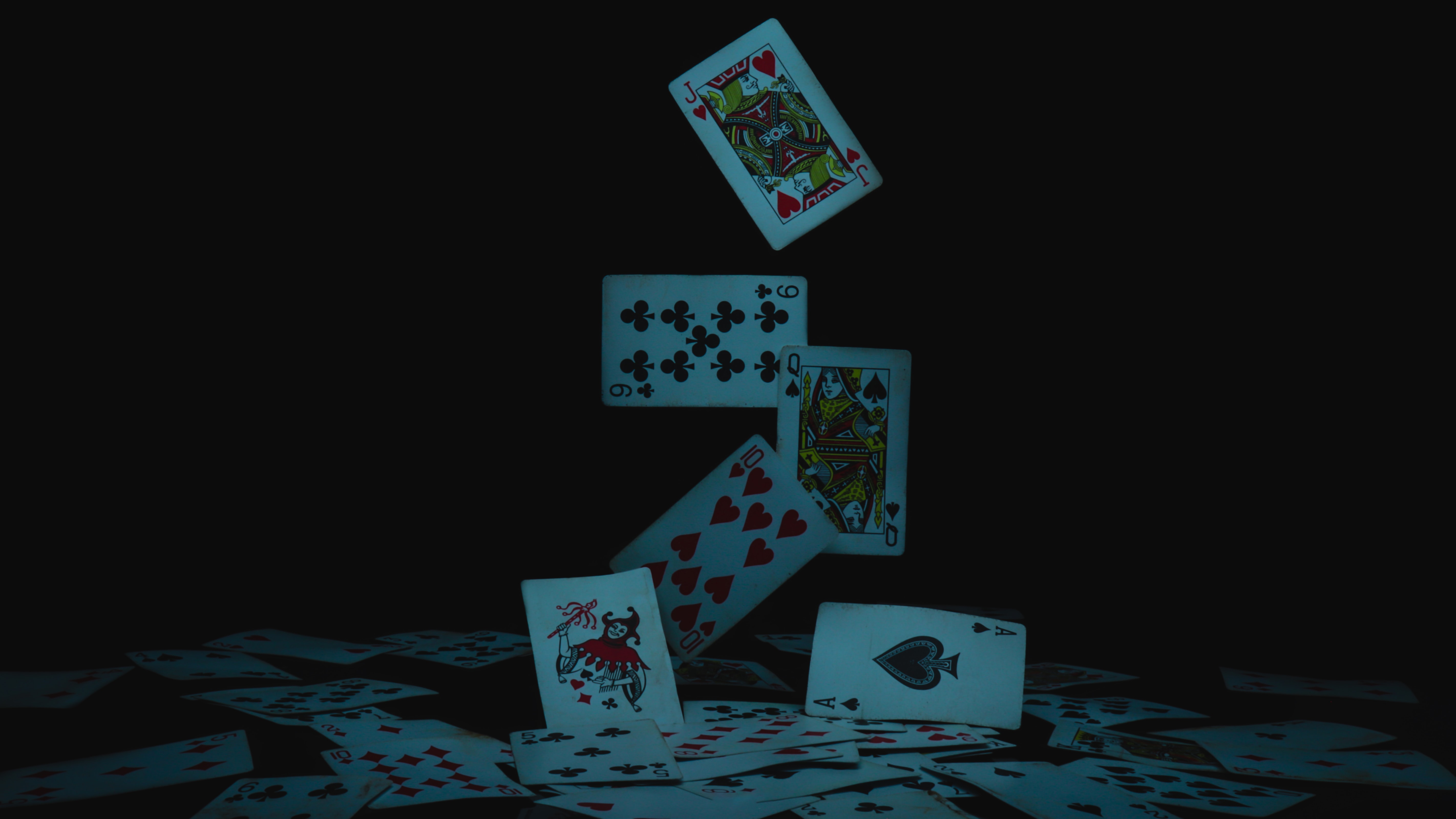 playing cards falling