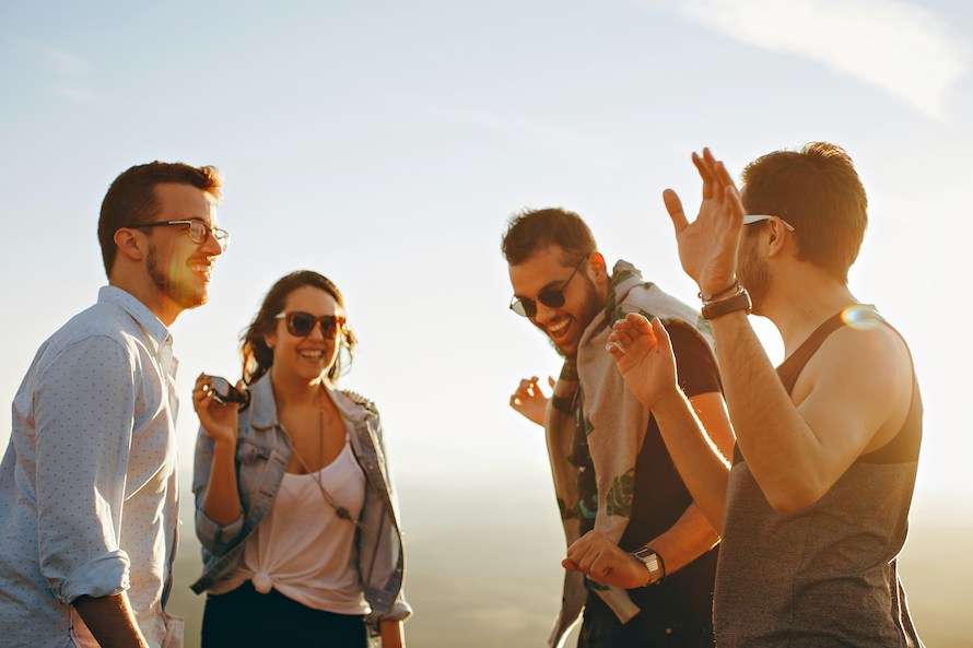 group of happy friends outside