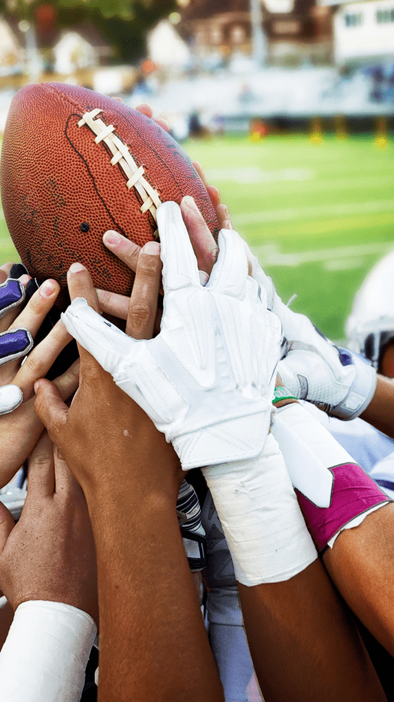 Team holding a football